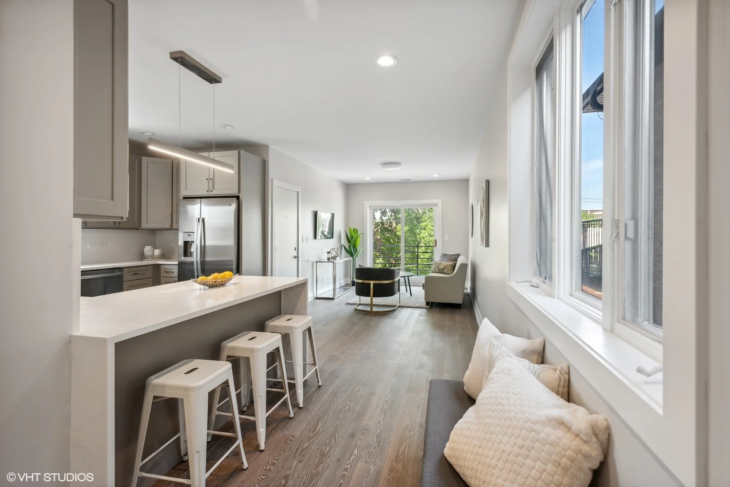 A renovated open-plan apartment with kitchen island